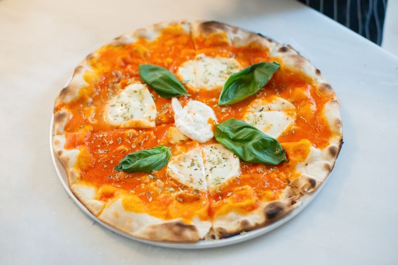 Fresh pizzaluce being served at catering